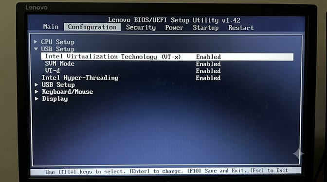 A Lenovo BIOS/UEFI Setup Utility on the Configuration tab, with Intel Virtualization Technology (VT-x), SVM Mode, and VT-d all set to Enabled.